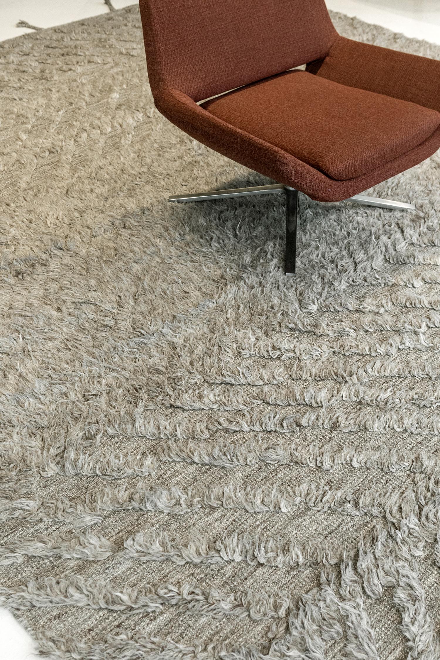 A plain and simple Zuma rug from ZigZigZag collection that features a zigzag pile weave pattern. This phenomenal work of art gives the inspiration to enhance your contemporary interiors. A gray tone that gives extra to your minimalist
