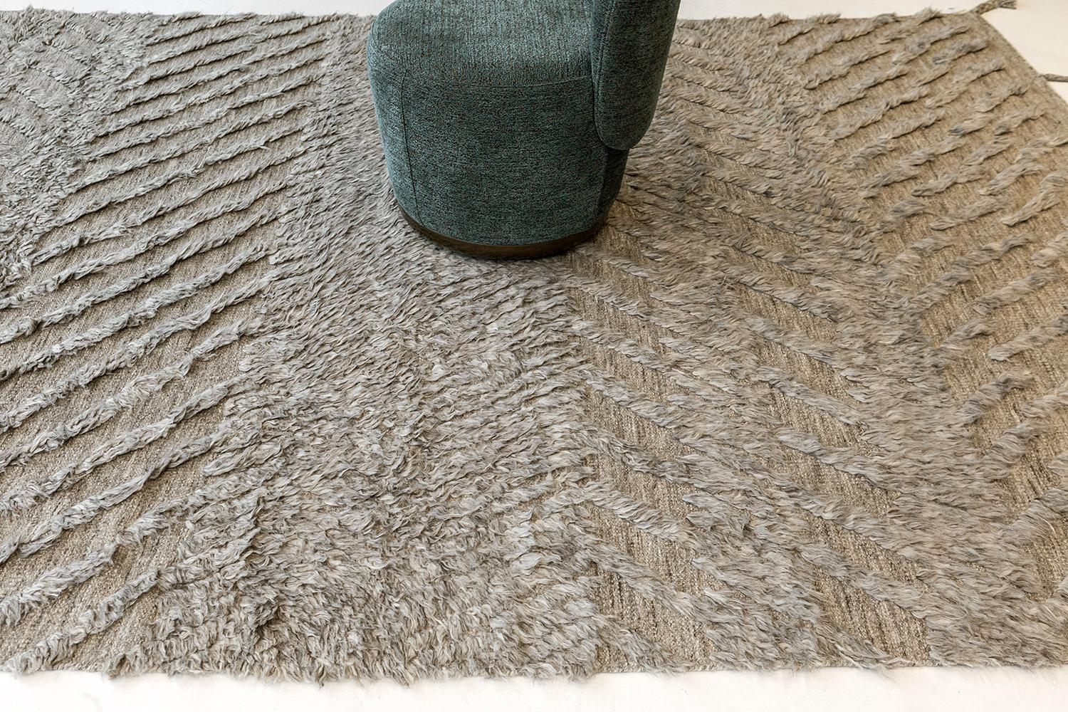 A plain and simple Zuma rug from ZigZigZag Collection that features a zigzag pile weave pattern. This phenomenal work of art gives the inspiration to enhance your contemporary interiors. A gray tone that gives extra to your minimalist