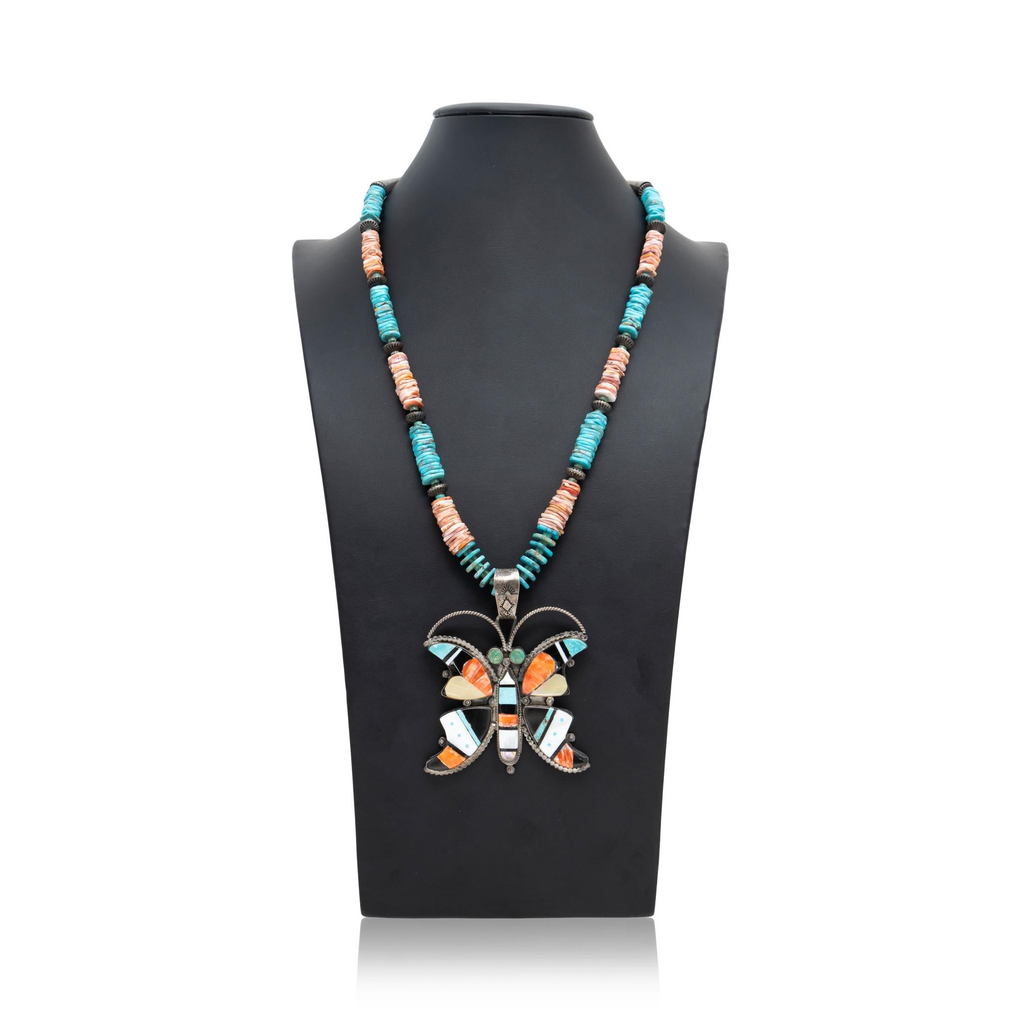 Native American Zuni Indian butterfly pendant Heishi stone necklace. Chain is made of Kingman turquoise, sterling silver and spiny oyster beads with natural cut shape, featuring pendant of a butterfly made of inlaid stones of turquoise, spiny