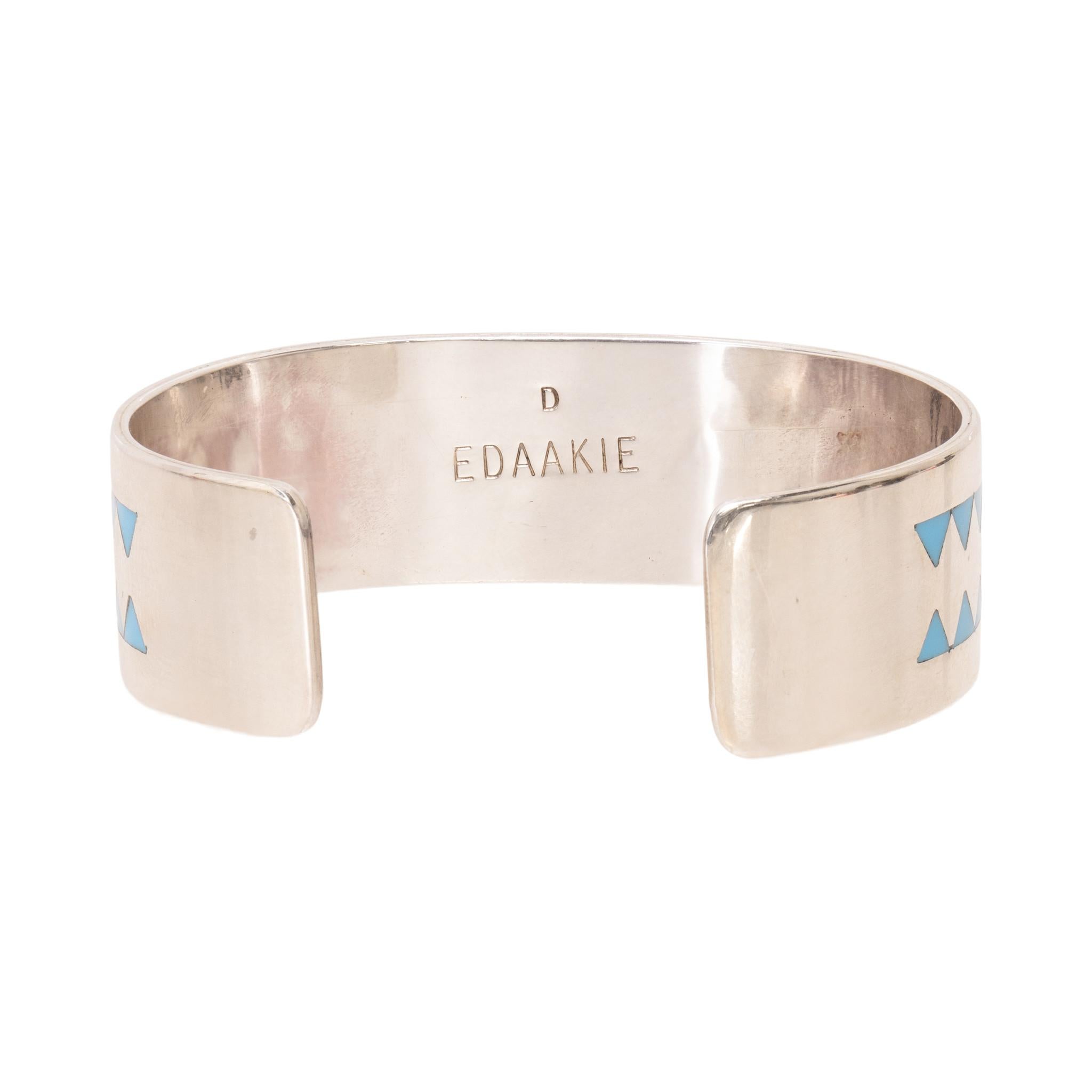 Zuni sterling silver and inlaid pictorial bracelet of a coral cardinal bird on branches. Inlaid stones of Sleeping Beauty turquoise, coral, onyx, and mother of pearl. Stamped sterling and maker's marked 