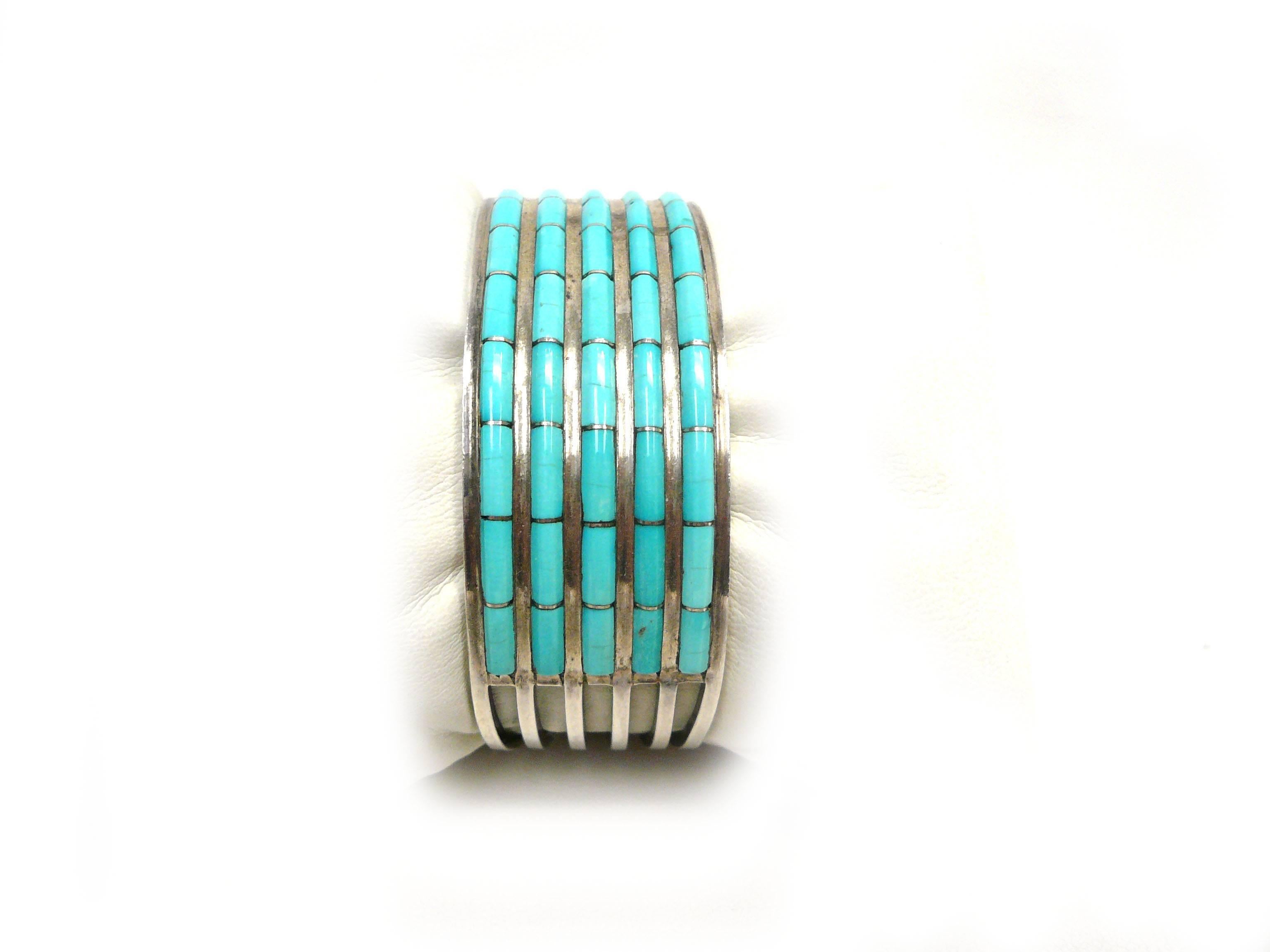 Handsome Cuff Turquoise & Sterling Silver. Bracelet features a spread wire design with five rows and turquoise inlay. Signed AWL for Zuni Native American Designer couple Anson and Letitia Wallace. The Zuni are known for their impeccable inlay