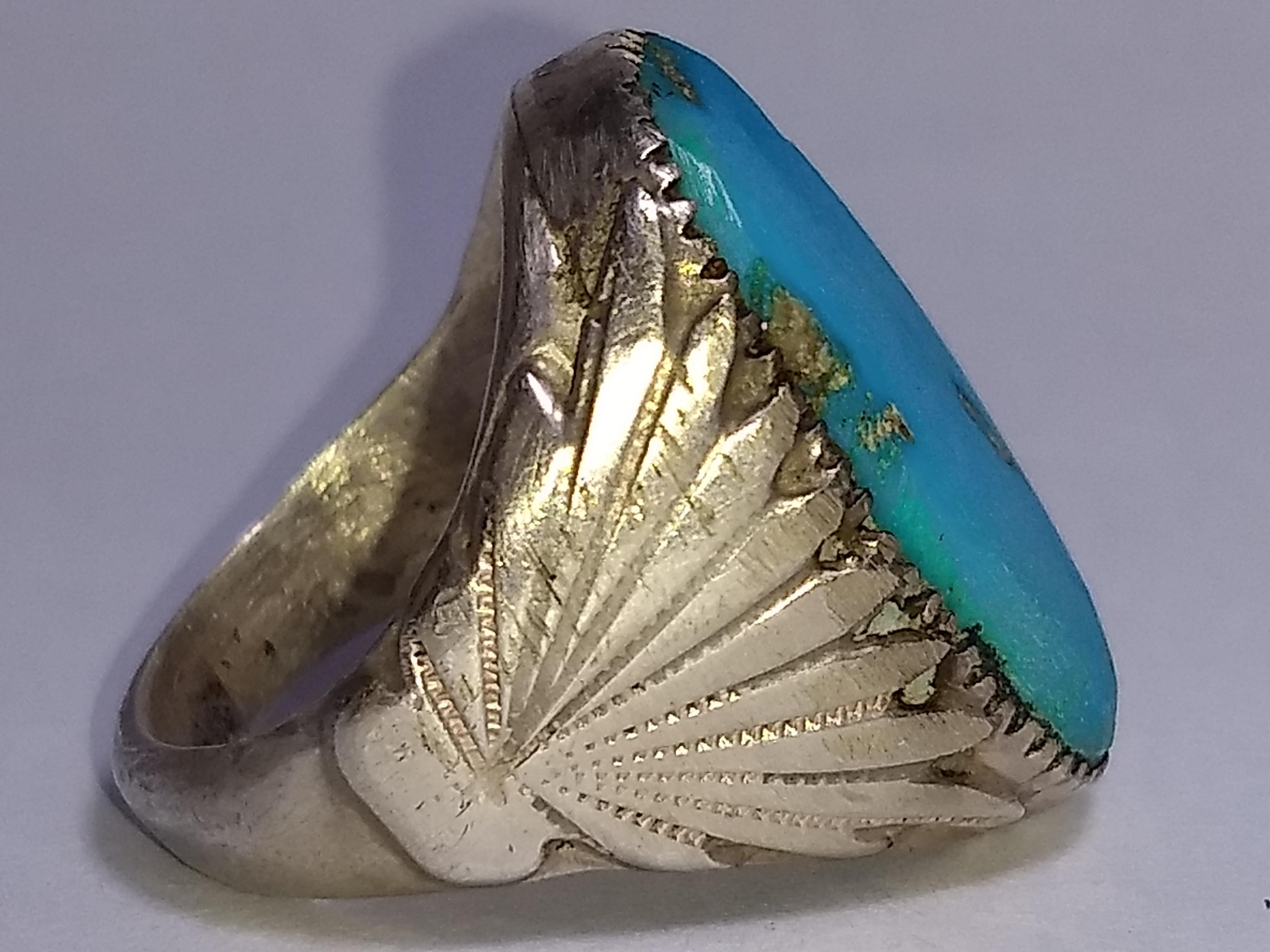 Large handmade Zuni Native American ring was made from sterling silver and kingman turquoise by husband and wife team: Robert and Bernice Leekya. Marked 