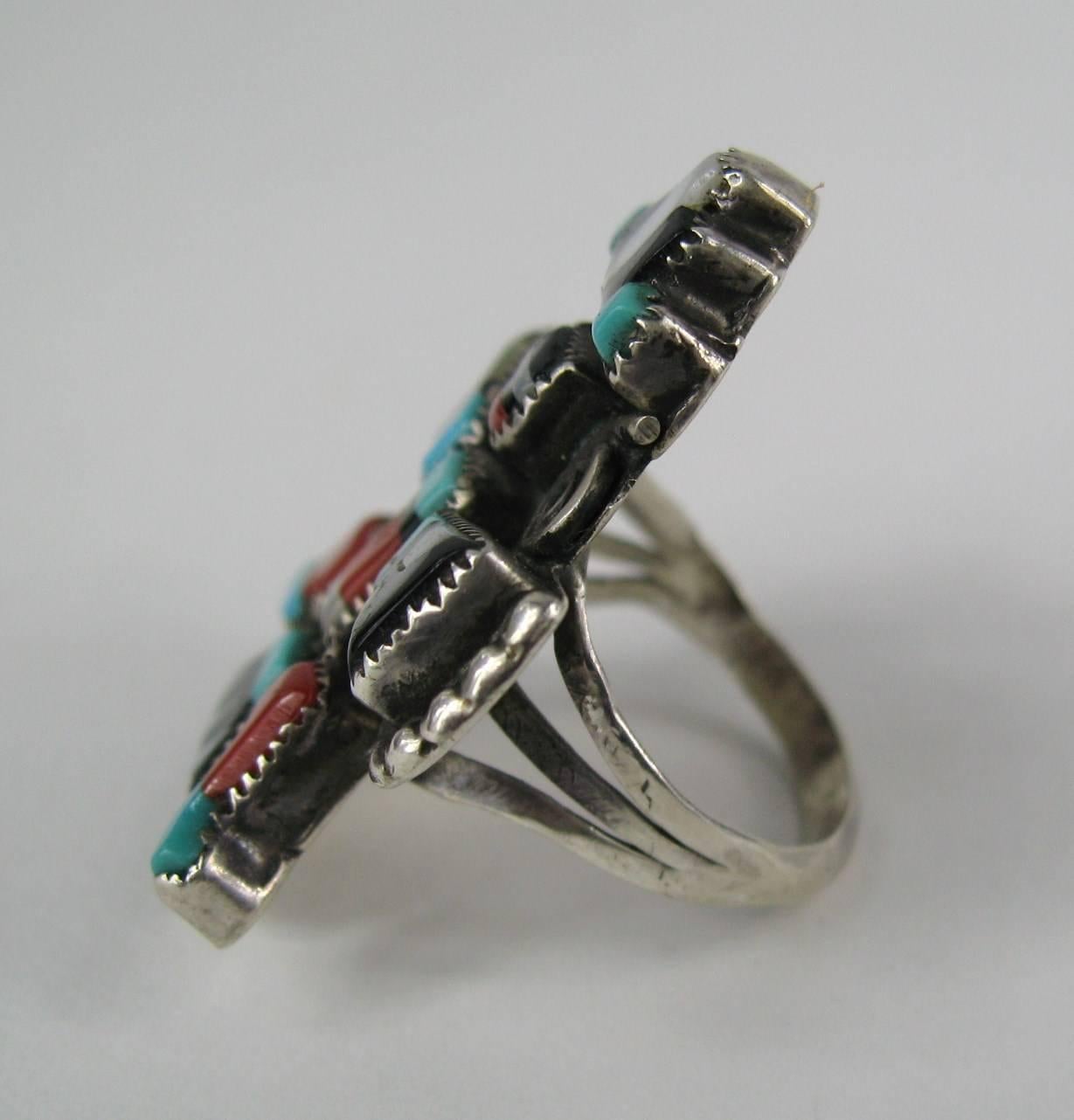 The ring is made up of Turquoise, Onyx, Mother of Pearl And Coral. Ring is a size 7.5- Measuring 1.47 in x 1.15 in. Hallmarked inside G.B Natachu. This is out of a massive collection of Hopi, Zuni, Navajo, Southwestern, sterling silver, costume