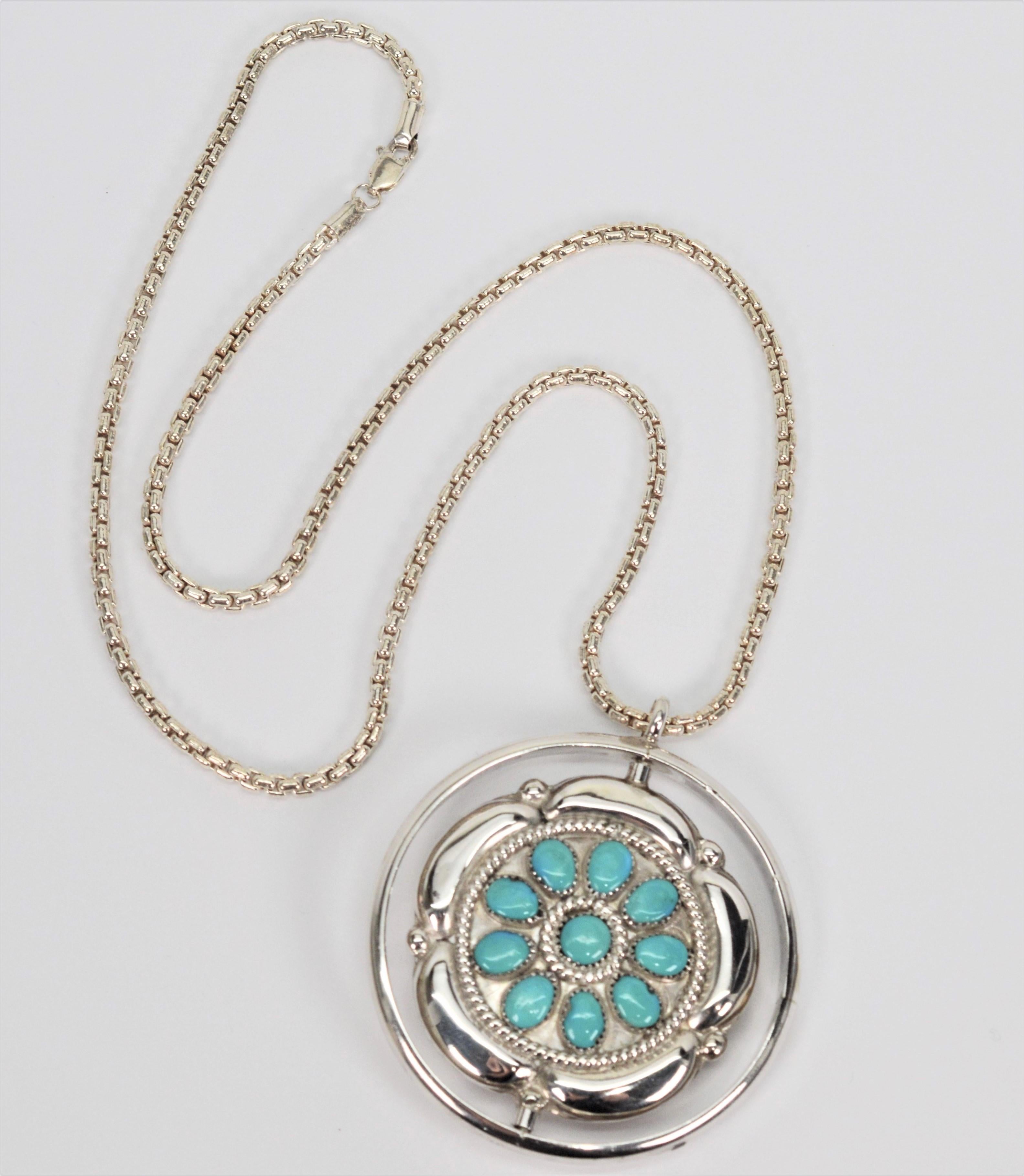 Vintage Zuni turquoise and coral flower silver spinner pendant crafted by known Zuni artisans Fred and Elsie Lonconsello. Southwest style colorful bursts have clusters of natural stone arranged in celestial inspired patterns. The spinner pendant