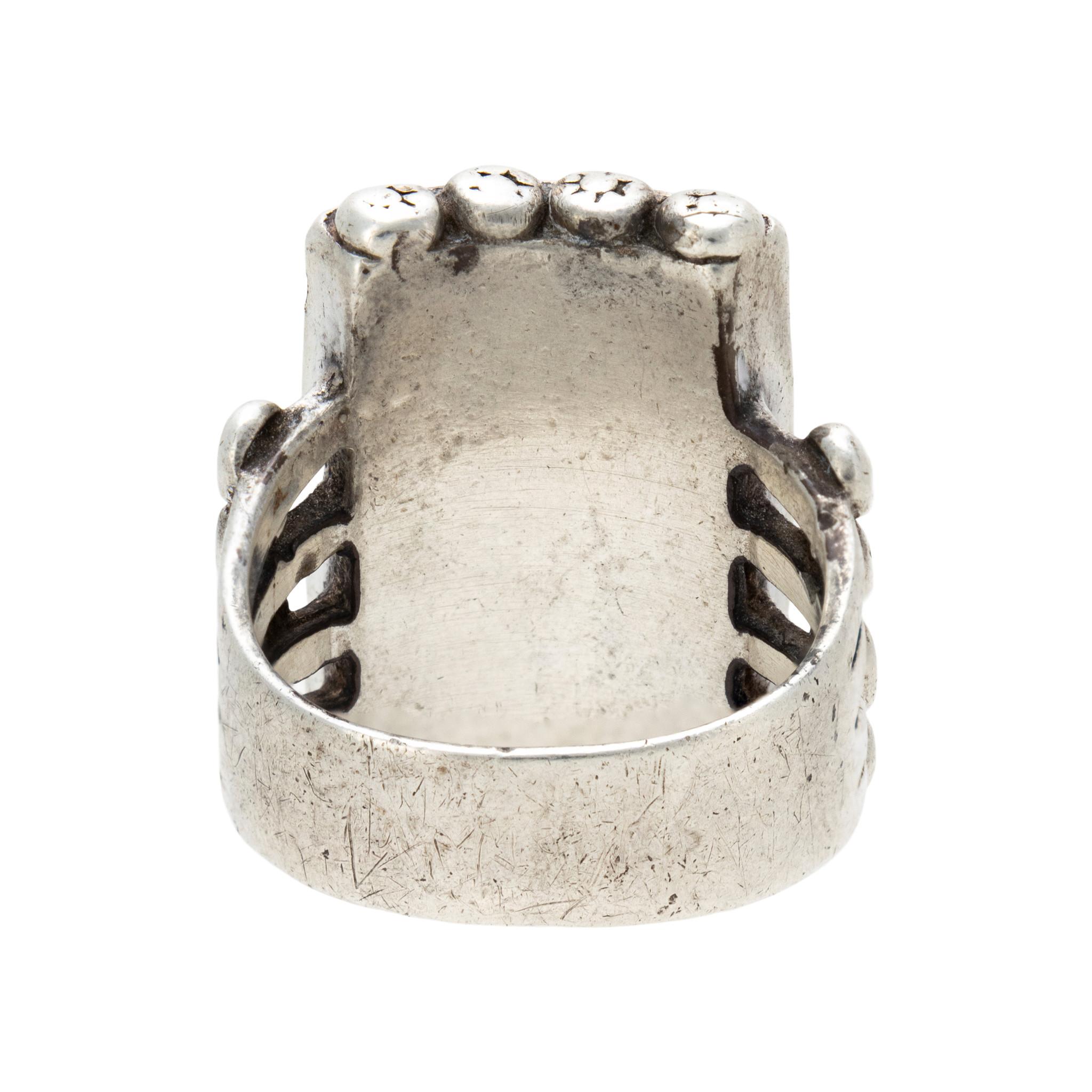 Zuni inlaid sterling silver and Sleeping Beauty turquoise ring with mother of pearl center. Nine squares with sterling bead design, stamping faded from frequent use. No maker's mark. Unusual piece, great for formal or casual Southwestern attire.