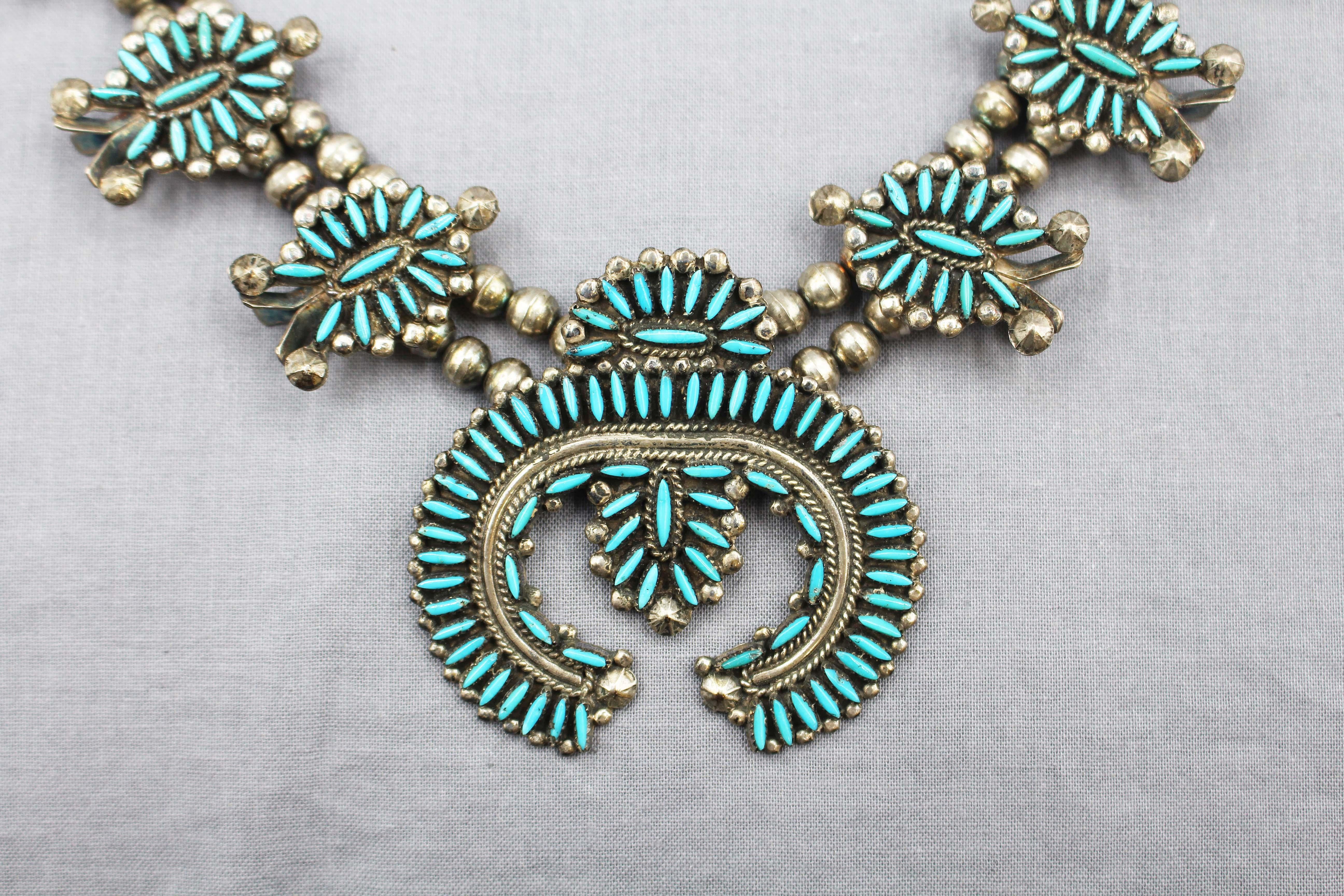 Zuni turquoise & sterling silver needlepoint squash blossom necklace & screw-back earrings by S.B. Luana, Zuni Tribe. Signed on necklace SBL. Original 1976 Silver Eagle Traders receipt with artisan's name & tribe available to buyer. Zuni needlepoint