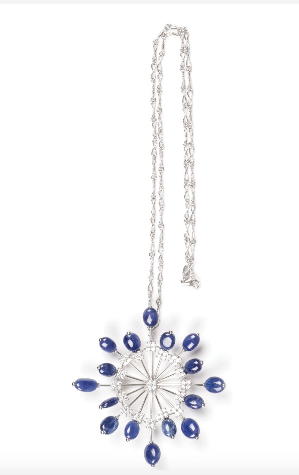 THIS IS A STUNNING MONUMENTAL ZYDO ITALIAN DIAMOND AND SAPPHIRE PENDANT NECKLACE IN 18 KARAT WHITE GOLD. 
The large and impressive pendant in the form of a magnificent starburst is set with 16 radiating oval cut sapphires and embellished with 68