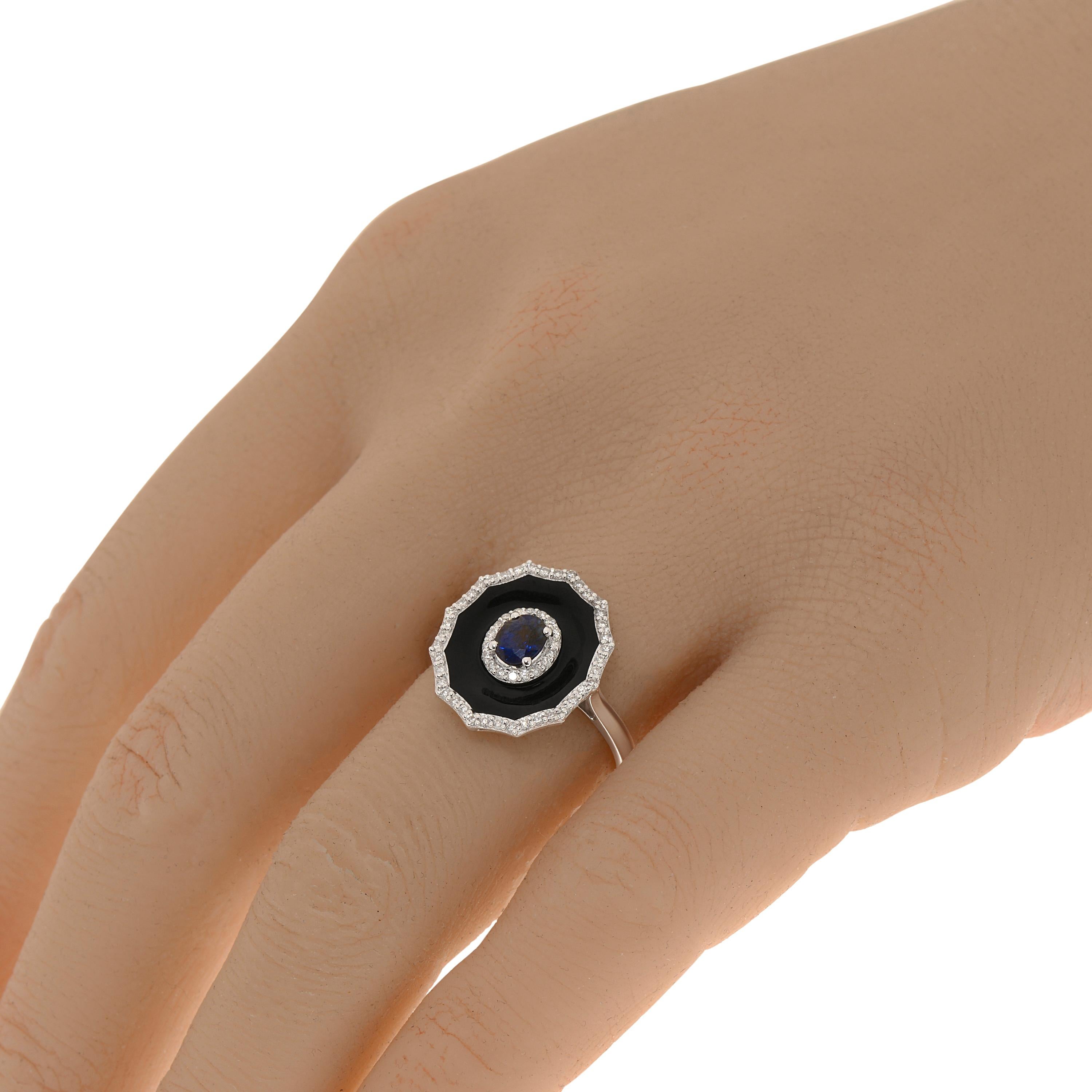 Zydo 18K white gold and enamel gemstone ring features 0.40ct. tw. blue sapphires surrounded by black enamel and 0.24ct. tw. diamond accents. The ring size is 7 (54.4). The ring measurements are 5/8