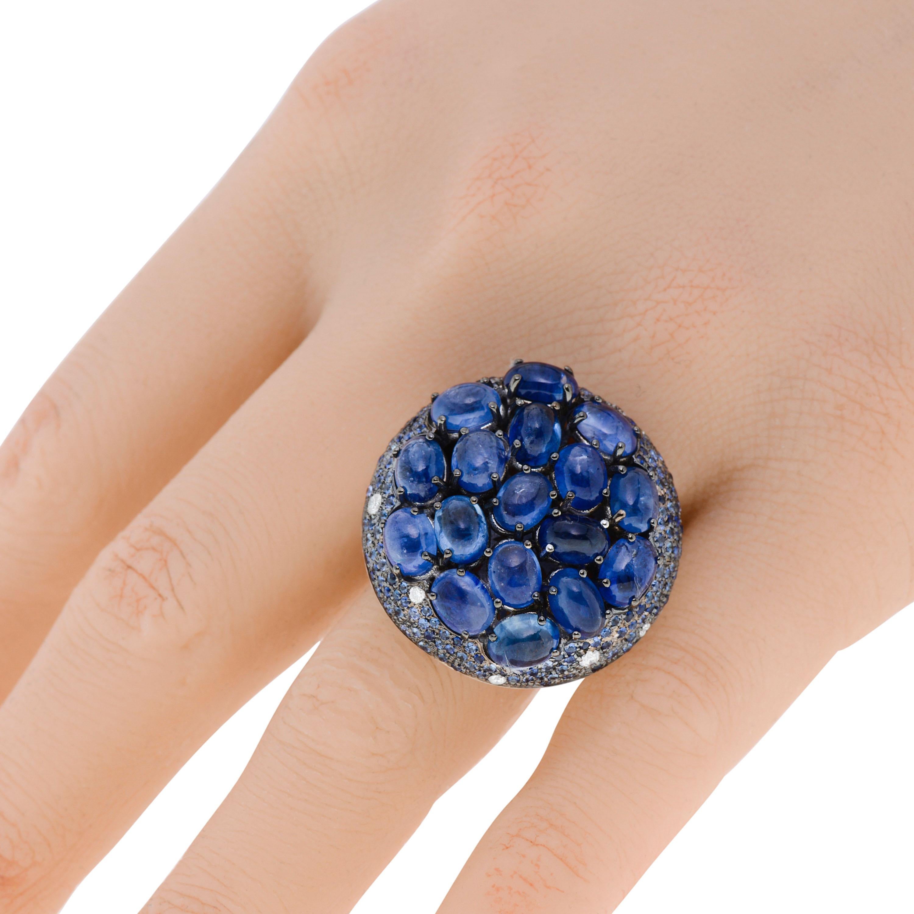 This Zydo 18K White Gold Statement Ring features a cluster of 16.91ct. tw. cabochon and pave sapphires adorned with 0.15ct. tw. round diamond accents. The ring size is 6.75 (53.8). The decoration size is 1 1/8