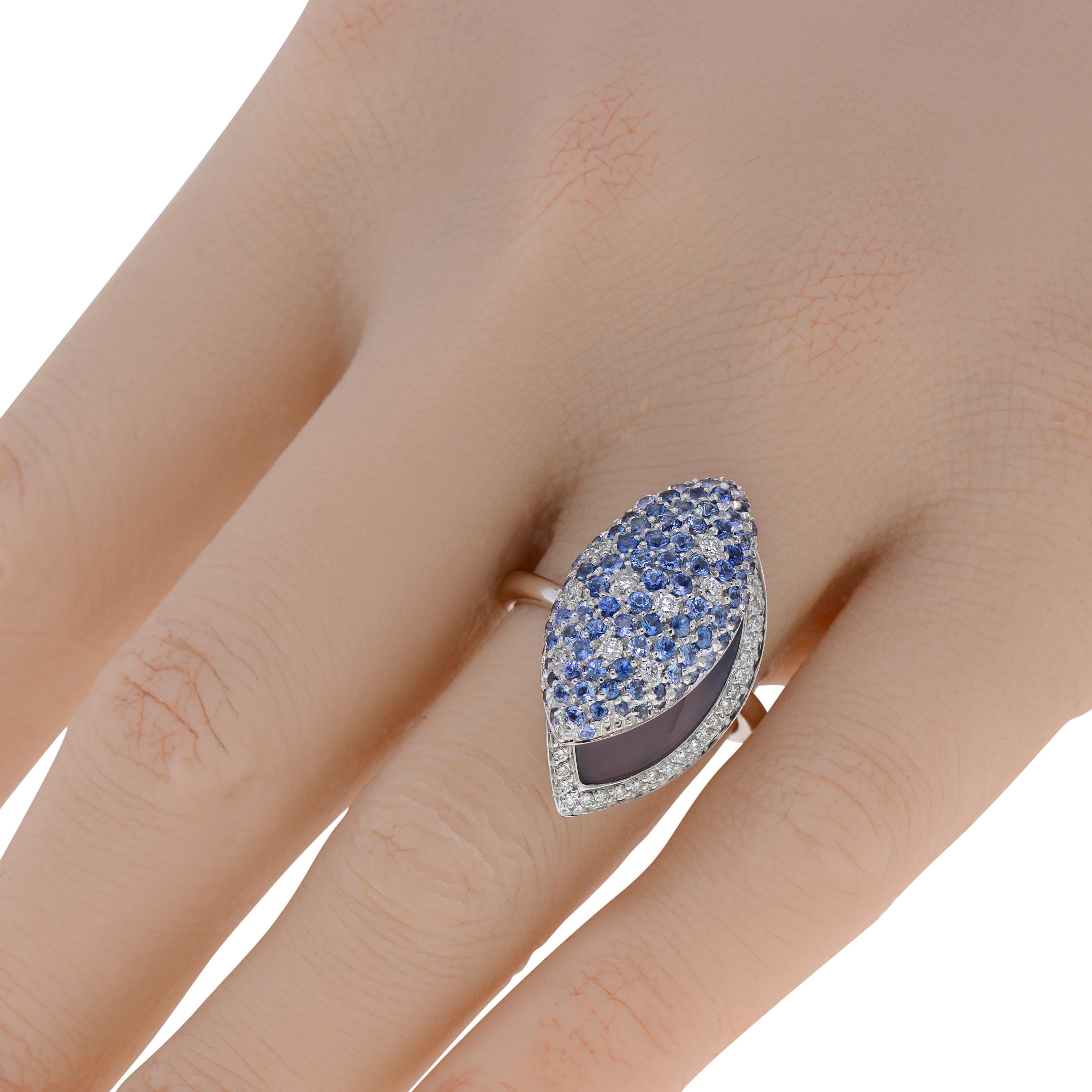 This glamorous Zydo 18K White Gold Band Ring features 1.46ct. tw. sapphire and 0.33ct. tw. pave diamonds accents over a 3.90ct. tw. center stone. The ring size is 6.75 (53.8). The decoration size is 5/8
