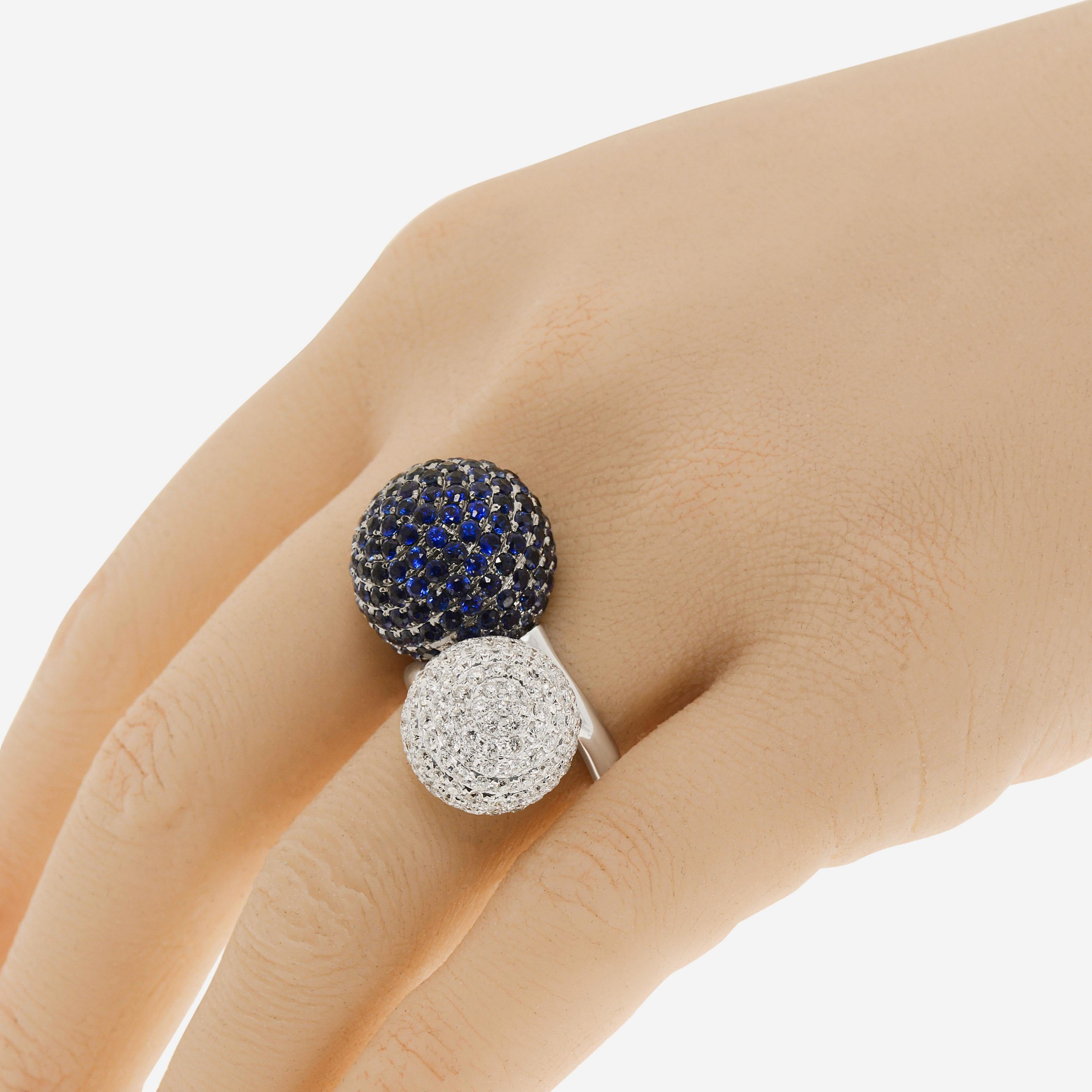 Zydo 18K white gold statement ring features two oversized spherical details clustered with 6.63ct. tw. sapphire and 2.67ct. tw. diamonds. The ring size is 6.5 (53.1). The decoration size is 1