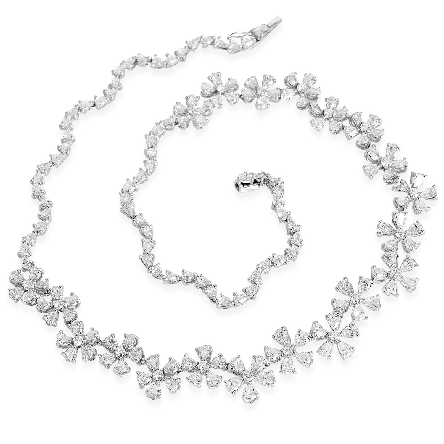 Estate ZYDO Diamond 18K Gold Floral Link Tennis Statement Necklace 

A gorgeous floral link Tennis necklace made in 18K White gold with Natural Pear and Round Diamonds. Half Floral Links and Half Wavey pear Links near the clasp. It is an all-rounder