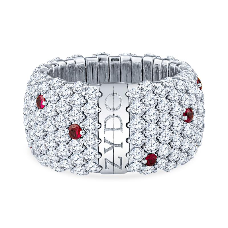This unique stretch ring is crafted in 18 karat white gold and features 5.85 carat total weight in round diamonds and 0.41 carat total weight in round rubies. It is comfortable and easy to slip on and off with its expanding stretch action. It is a