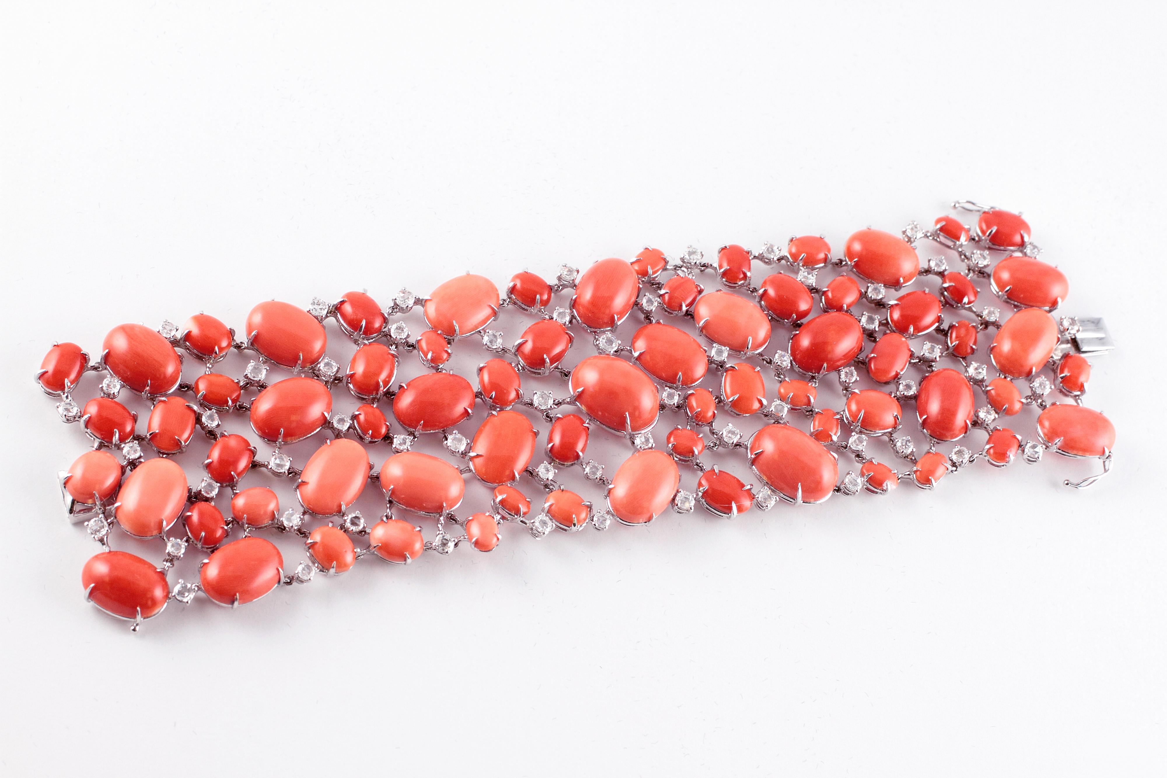 Lovely cabochon-cut coral stones in various shades alternating with rose-cut diamonds makes this bracelet a show stopper! It measures 7 inches in length x 2 inches in width and is as light as a feather on your wrist.  The 2008 Neiman Marcus receipt