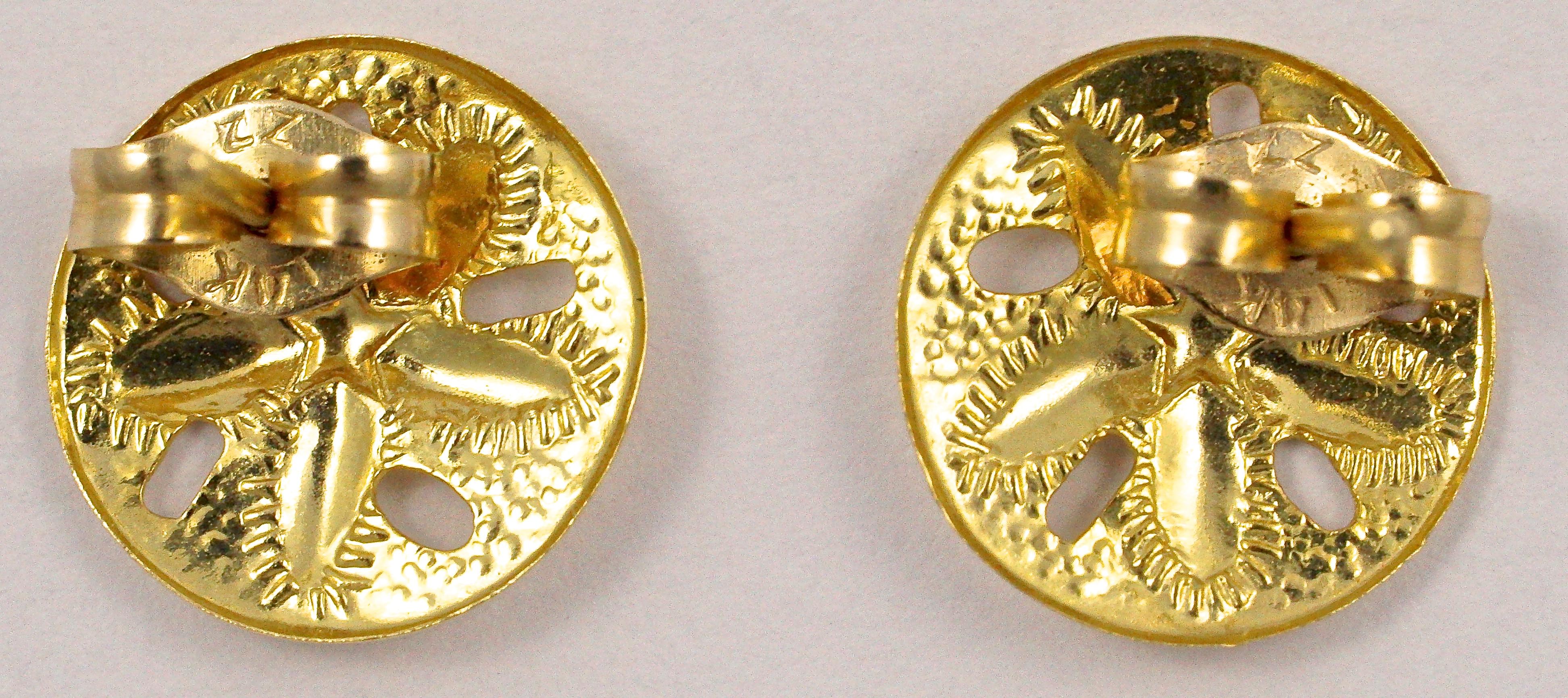 ZZ 14K gold round stud earrings with butterfly backs, and featuring a textured and shiny sand dollar design. The earrings measure diameter 9mm / .35 inch, and weigh .4 gram.

This is a lovely pair of gold earrings in an unusual and attractive sand